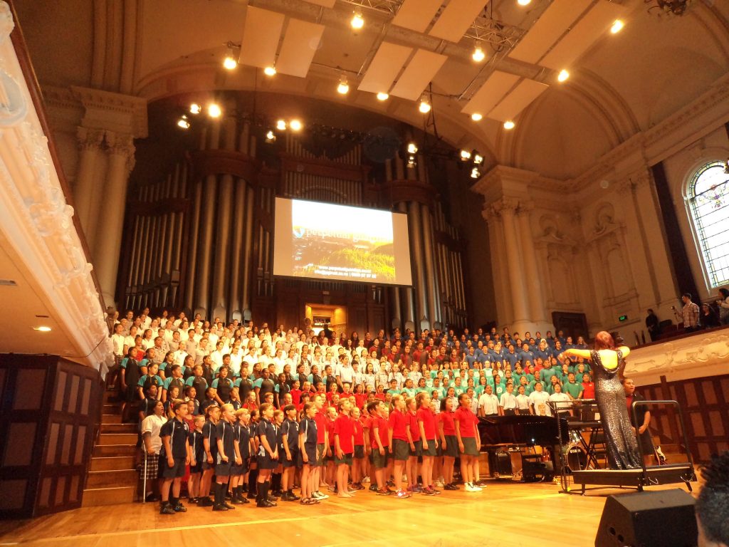 Junior Choir on Stage at the Town Hall | Sancta Maria College